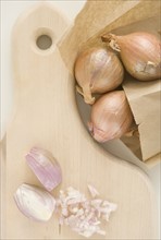 Chopped onions on cutting board. Date : 2006