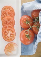Sliced tomatoes on cutting board. Date : 2006