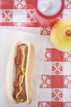 High angle view of hot dog with ketchup and mustard. Date : 2006