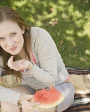 Woman laughing and eating watermelon. Date : 2006