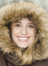 Portrait of woman wearing fur lined hood. Date : 2007