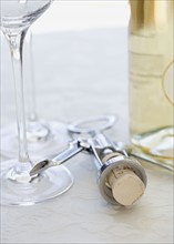 Close up of corkscrew and wine glasses. Date : 2006
