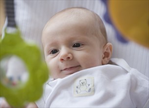 Baby smiling at mobile. Date : 2007