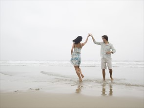 Couple dancing at beach. Date : 2006