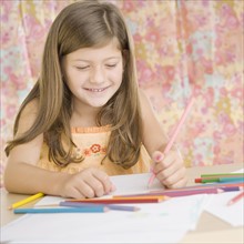 Young girl smiling and coloring. Date : 2006