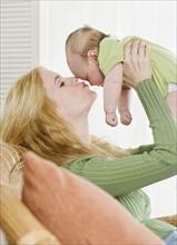 Mother kissing baby. Date : 2006