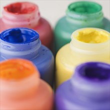 Closeup of open paint bottles. Date : 2006