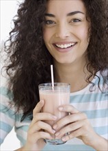 Woman drinking milkshake. Date : 2007