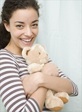 Woman hugging teddy bear. Date : 2007