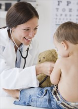 Doctor examining baby. Date : 2007