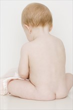 Rear view of nude baby. Date : 2007