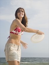 Woman playing game at beach. Date : 2007