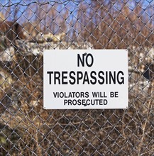 No Trespassing sign on fence. Date : 2007