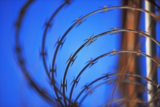Close up of coiled razor wire. Date : 2007