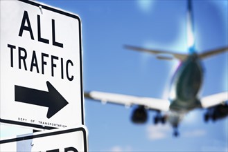 All traffic sign and airplane in background. Date : 2007