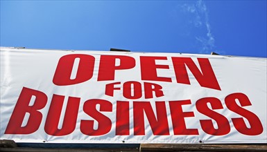 Low angle view of Open for Business sign. Date : 2007