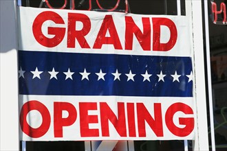 Grand Opening sign in store window. Date : 2007
