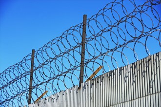 Low angle view of barbed wire fence. Date : 2007