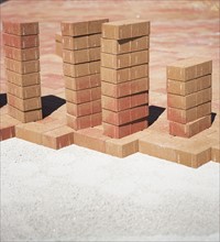 Stacks of bricks on edge of new patio. Date : 2007