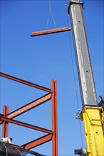 Crane holding steel girder. Date : 2007