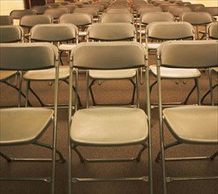 Empty folding chairs in rows. Date : 2007