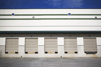 Row of closed loading docks. Date : 2007