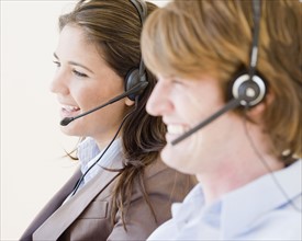 Businesspeople wearing headsets. Date : 2007