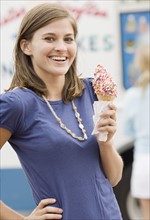 Woman holding ice cream cone. Date : 2007