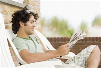 Man reading newspaper. Date : 2007
