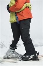 Couple on skis hugging. Date : 2007