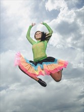 Low angle view of woman jumping. Date : 2007