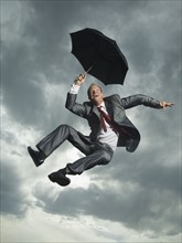 Low angle view of businessman jumping. Date : 2007