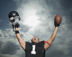 Low angle view of football player cheering. Date : 2007