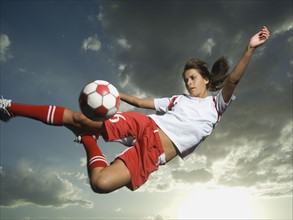 Low angle view of soccer player jumping. Date : 2007
