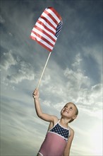 Young girl holding American flag. Date : 2007