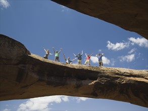 People cheering on rock formation. Date : 2007
