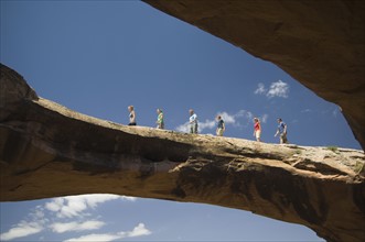 People walking on rock formation. Date : 2007