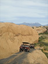 Off-road vehicles driving on rock formation. Date : 2007