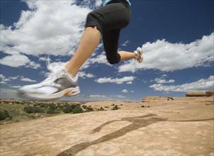 Woman jumping in desert. Date : 2007