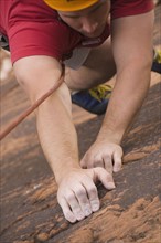 Close up of man rock climbing. Date : 2007