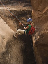 Woman canyon rappelling. Date : 2007