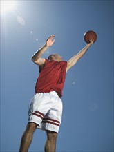 Man jumping with basketball. Date : 2007