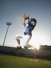 Young football player catching ball. Date : 2007