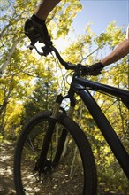 Person riding mountain bike, Utah, United States. Date : 2007