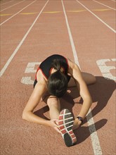 Female runner stretching, Utah, United States. Date : 2007
