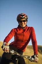 Woman on mountain bike, Salt Flats, Utah, United States. Date : 2007