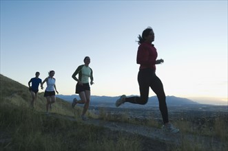 Group of people running on trail, Salt Flats, Utah, United States. Date : 2007