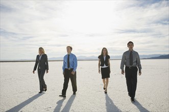 Businesspeople walking on salt flats, Salt Flats, Utah, United States. Date : 2007