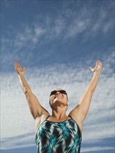 Female swimmer with arms raised, Utah, United States. Date : 2007