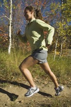 Woman jogging on trail, Utah, United States. Date : 2007